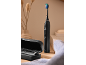 Brosse à dents sonique rechargeable Dentalux noire avec étui de voyage.