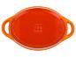 Plat à four ovale orange SilverCrest avec deux poignées.