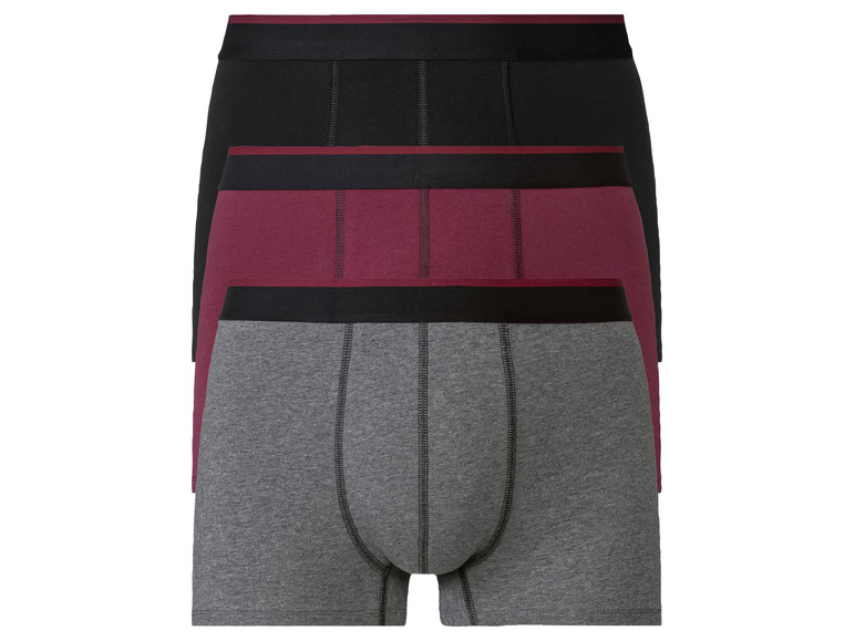 Trois boxershorts en noir, gris et bordeaux.