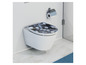 Toilette avec un siège de toilette rond gris et blanc