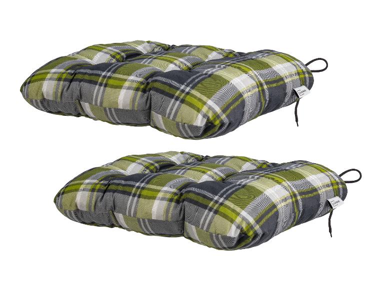Deux coussins de chaise à carreaux verts, gris et blancs avec des attaches
