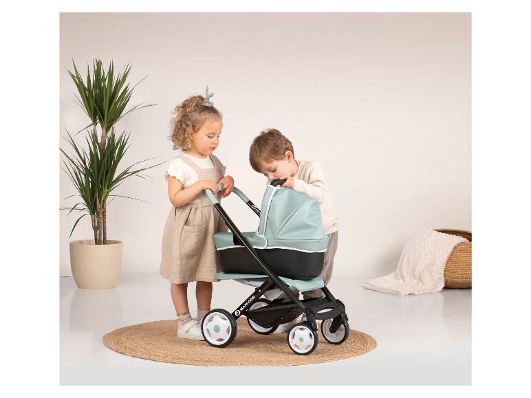 Deux enfants regardent une poussette Maxi-Cosi.