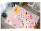 Tapis enfant rose avec licorne, soleil et papillons.