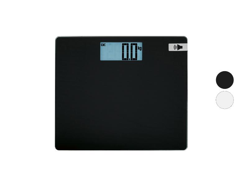 Pèse-personne noir avec affichage numérique indiquant « 0.0 kg » et une icône de haut-parleur.