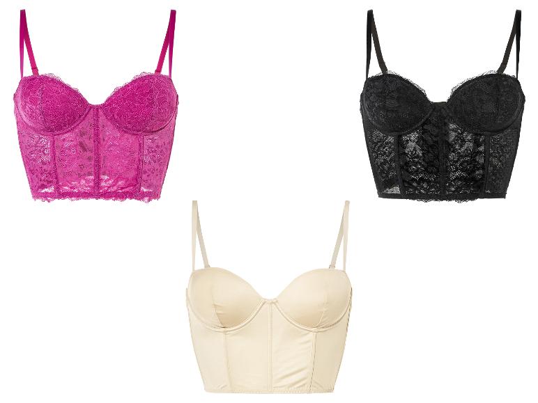 Trois bustiers en dentelle rose, noir et crème.