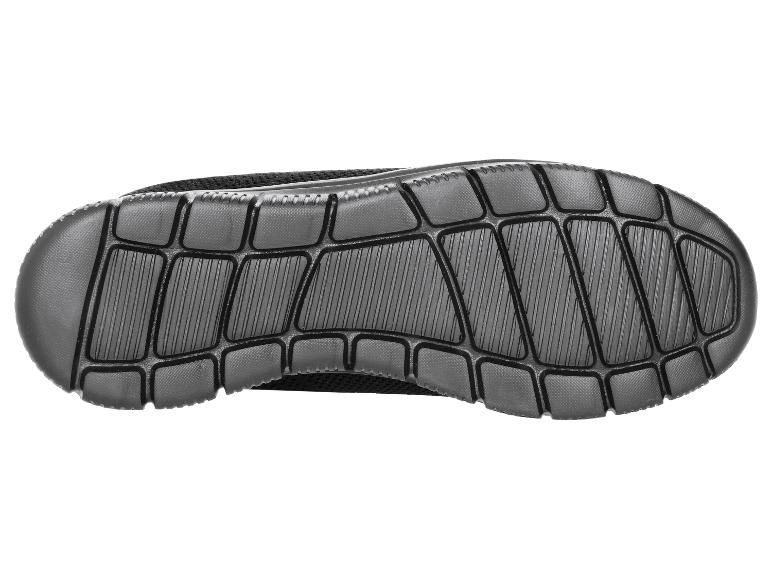 Semelle d'une chaussure de sport noire avec motif texturé