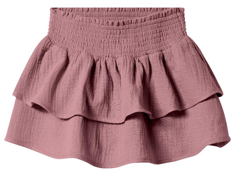 Jupe courte rose avec taille smockée et volants