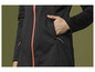 Une veste softshell noire avec une fermeture éclair rose