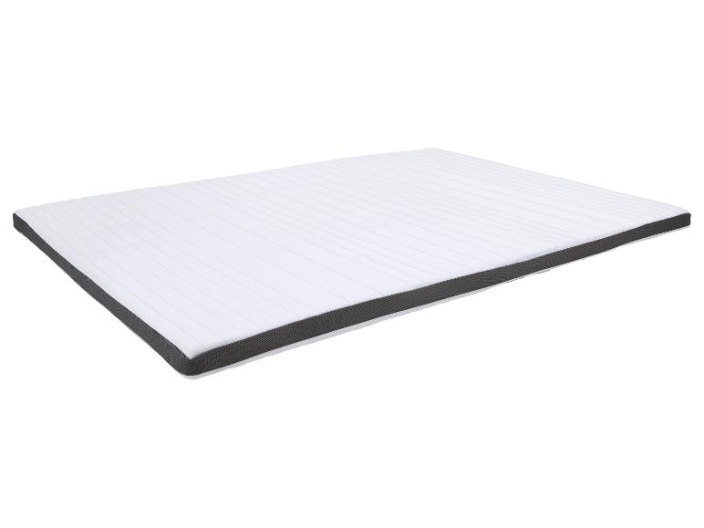 Surmatelas blanc avec côtés gris, présenté en angle.