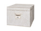 Boîte de rangement beige avec un motif de feuilles blanches.