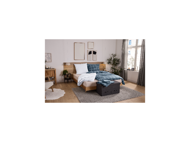 Oreiller LIVARNO® blanc sur un lit double confortable.