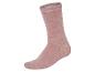 Une chaussette rose pâle en coton.