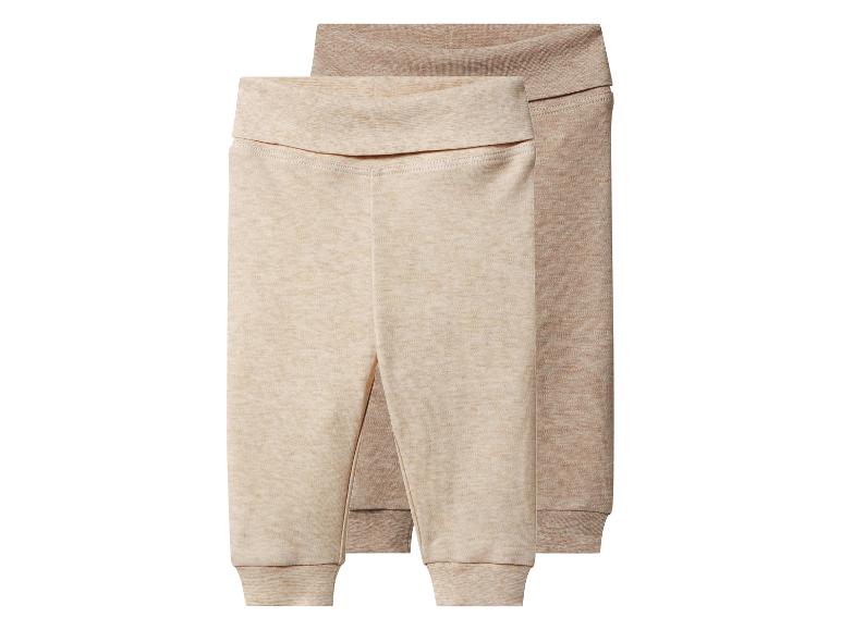 Deux pantalons de bébé dans des tons beige et marron clair