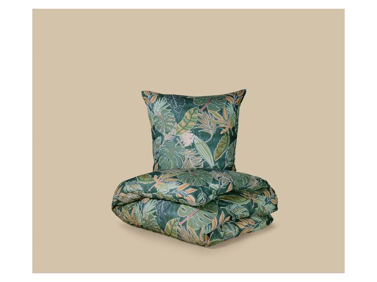 Parure de lit à motif feuilles tropicales dans les tons verts et beiges.