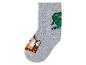 Une chaussette grise avec un dinosaure vert et un tigre orange.