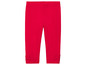Leggings rouges avec des nœuds en bas.