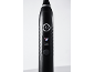 Gros plan d'une brosse à dents électrique noire avec bouton d'alimentation et indicateur de mode 'Nettoyage de la langue'.