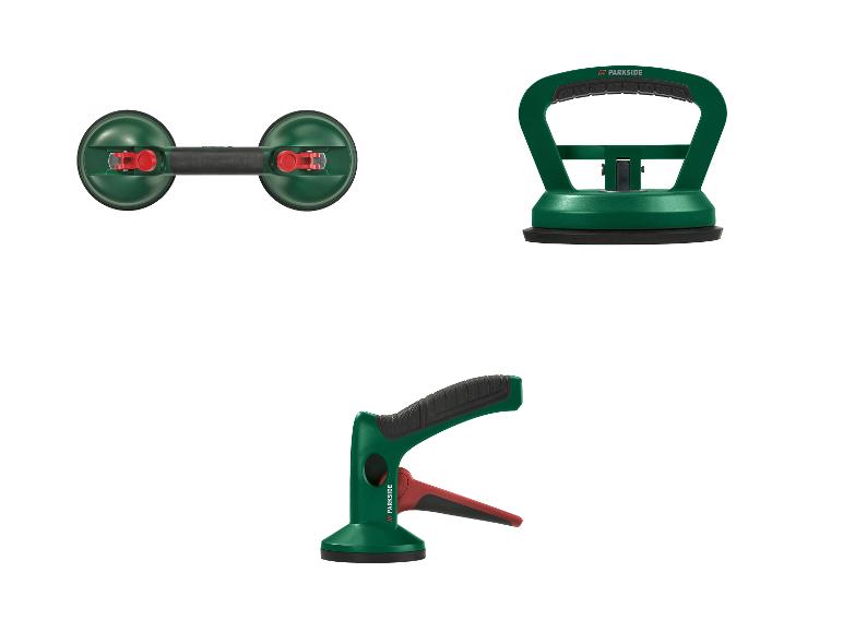 Trois ventouses vertes pour verre et carrelage avec des détails noirs et rouges.