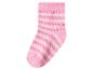 Chaussette rose pour enfant avec rayures blanches et oranges.
