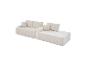 Canapé modulaire en velours côtelé crème avec coussins, design moderne et confortable.