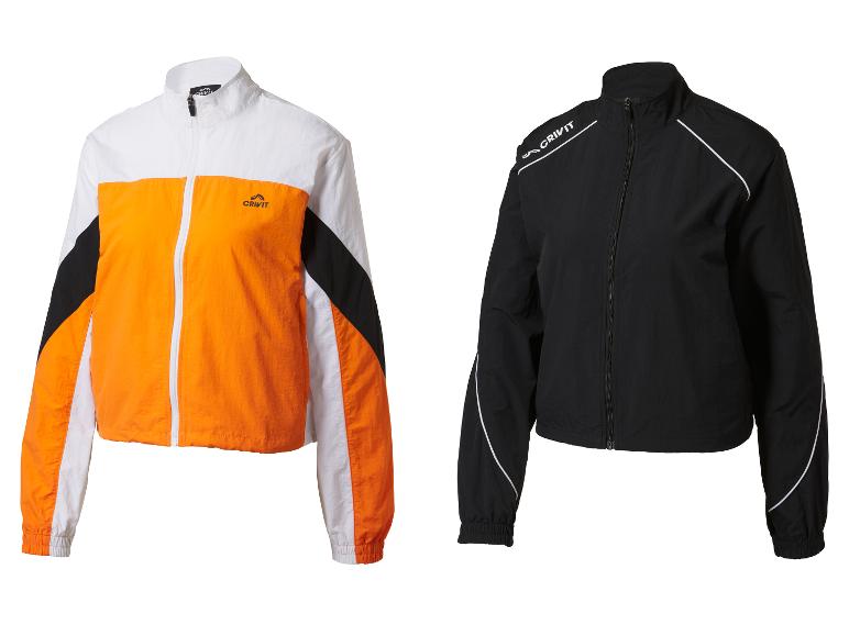 Deux vestes de sport Crivit : orange et blanc, et noir avec des détails blancs.