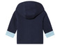 Un sweat-shirt à capuche bleu marine avec des poignets bleu clair.