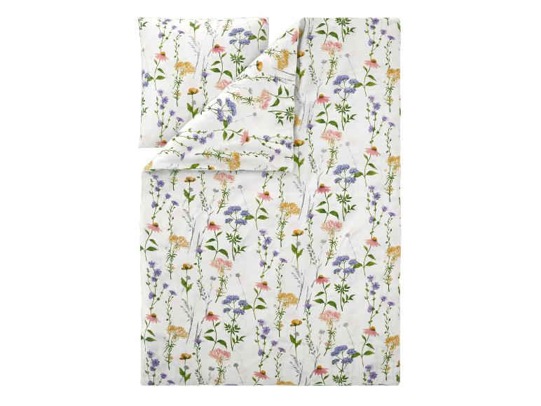 Parure de lit avec housse de couette et taie d'oreiller à imprimé floral de fleurs sauvages colorées sur fond blanc.