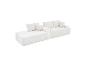 Canapé modulaire blanc avec coussins, au design moderne et accueillant.