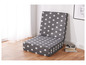 Un canapé-lit gris avec un motif d'étoiles blanches.