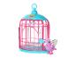 Une cage à oiseaux rose Little Live Pets avec un oiseau violet à côté.
