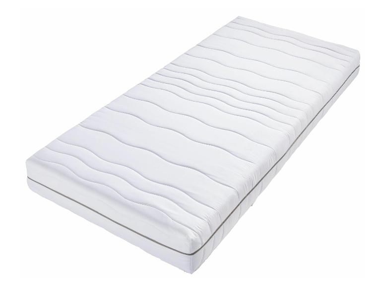Un matelas blanc avec un matelassage ondulé.