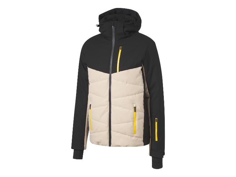 Une veste de ski noire et beige avec des accents jaunes.