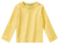Un t-shirt à manches longues jaune pour bébé