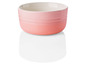 Un bol rose Le Creuset.