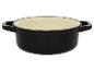 Cocotte en fonte noire avec couvercle beige.