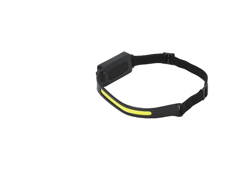 Lampe frontale LED noire avec bande lumineuse jaune, vue de côté