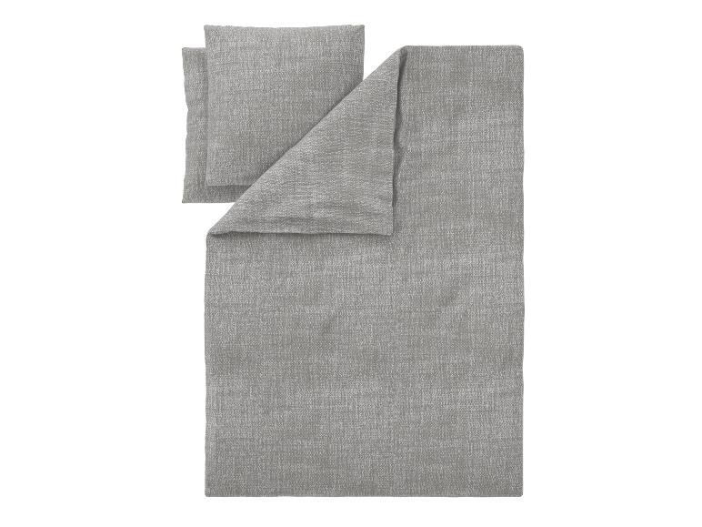 Parure de lit grise et taies d'oreiller sur fond blanc