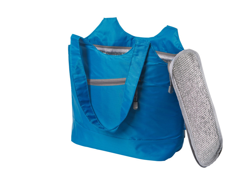 Un sac isotherme bleu avec un panneau réfrigérant argenté.