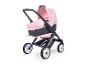 Une poussette Maxi-Cosi rose avec une nacelle.
