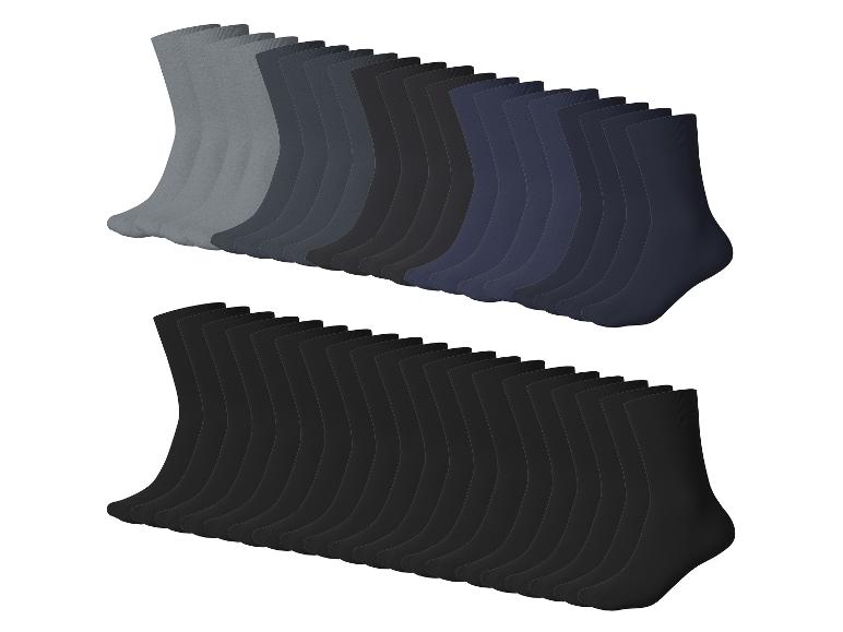 Deux rangées de chaussettes pour hommes dans des tons de gris, noir et bleu