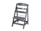 Une chaise haute Tripp Trapp grise.