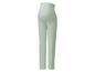 Un pantalon de grossesse vert clair.