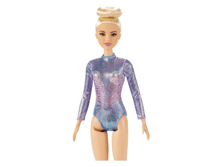 Poupée Barbie avec un justaucorps de gymnastique scintillant.