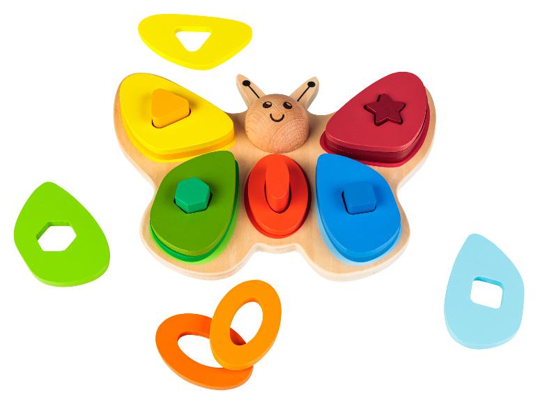Jouet en bois en forme de papillon avec des pièces de couleurs à emboîter.