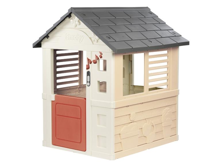 Maisonnette de jeu beige et orange pour enfants avec toit gris et notes de musique.