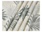 Tissu à imprimé feuilles tropicales grises et beiges, avec des plis doux.