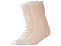 Trois paires de chaussettes beiges et blanches, dont une à rayures zébrées.