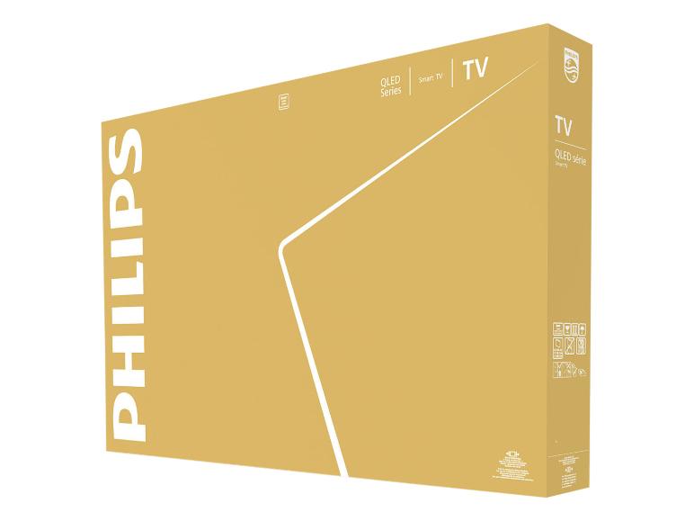 Boîte marron pour une Smart TV QLED avec les détails du produit et les instructions de manipulation.