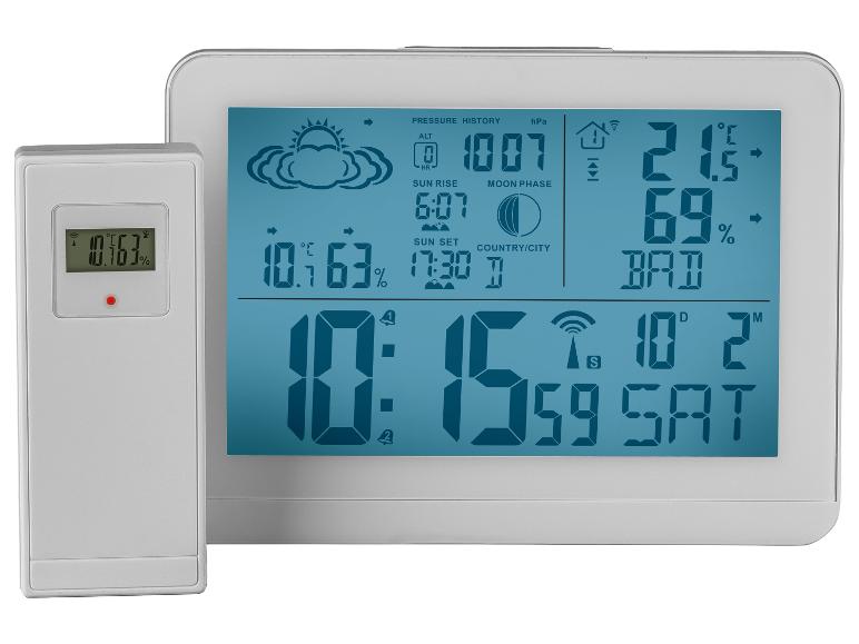 Station météo numérique avec capteur sans fil affichant l'heure, la date, la température et l'humidité.