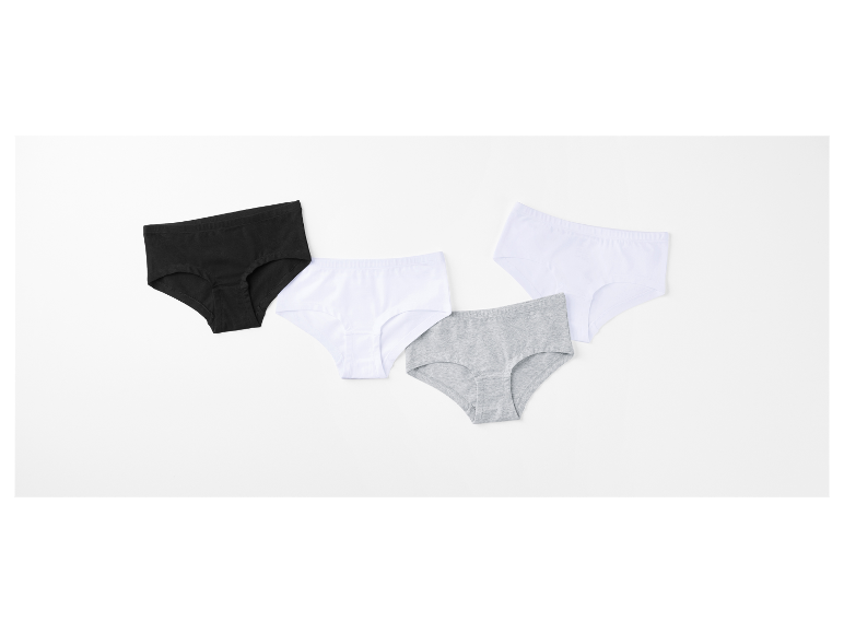 Trois paires de culottes en coton noir, blanc et gris.